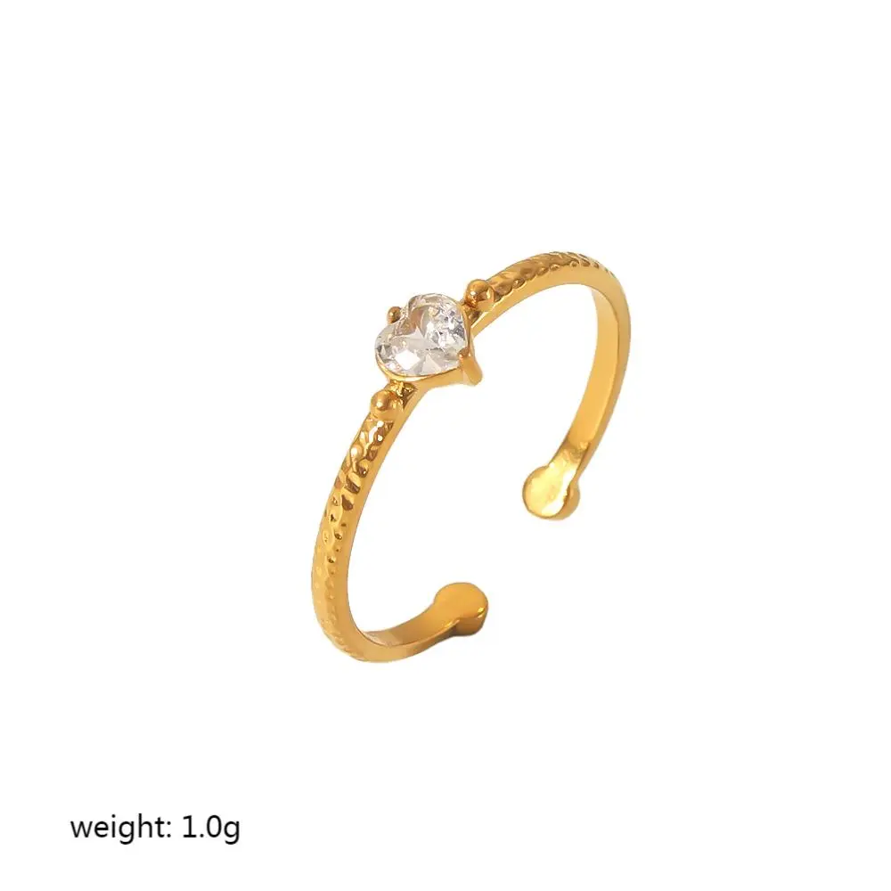 Goldfarbe / One size / 1 Stück schlichter, klassischer Ring aus Edelstahl in Herzform, 18 Karat vergoldet mit Zirkonia und Edelsteineinlage für Damen Bild4