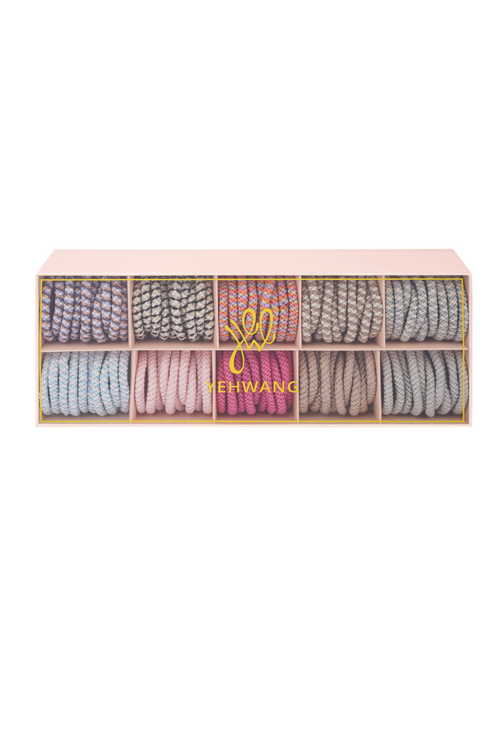 Box mit elastischen Haararmbändern in farbenfroher Atmosphäre – mehrfarbig Bild2