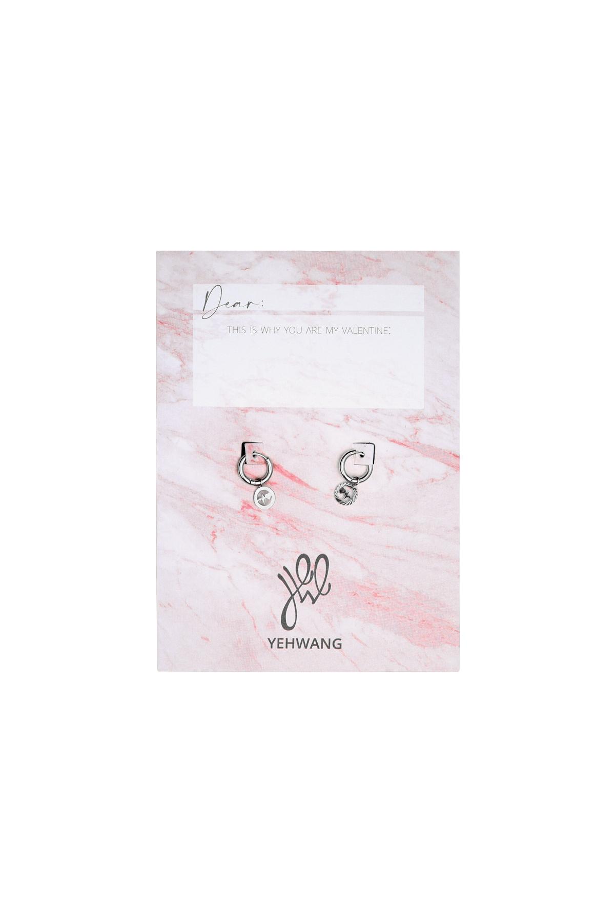 Pendientes con dije del latir de un corazón